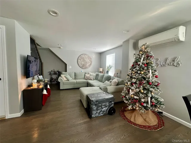 a living room with furniture window and a potted plant