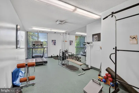 a living room with lots of furniture and a flat screen tv