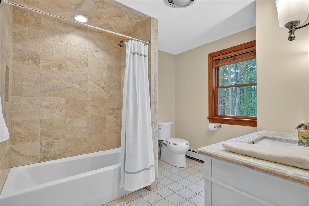 55 Sheffield Road Boxford, MA 01921 - Photo 24 of 42 a bathroom with a sink toilet and shower