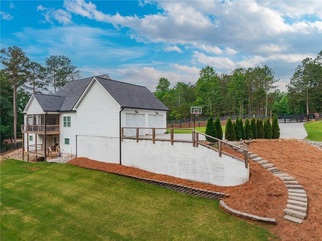 2250 Sperin Road Ball Ground, GA 30107 - Photo 7 of 56 a view of a house with pool and a yard