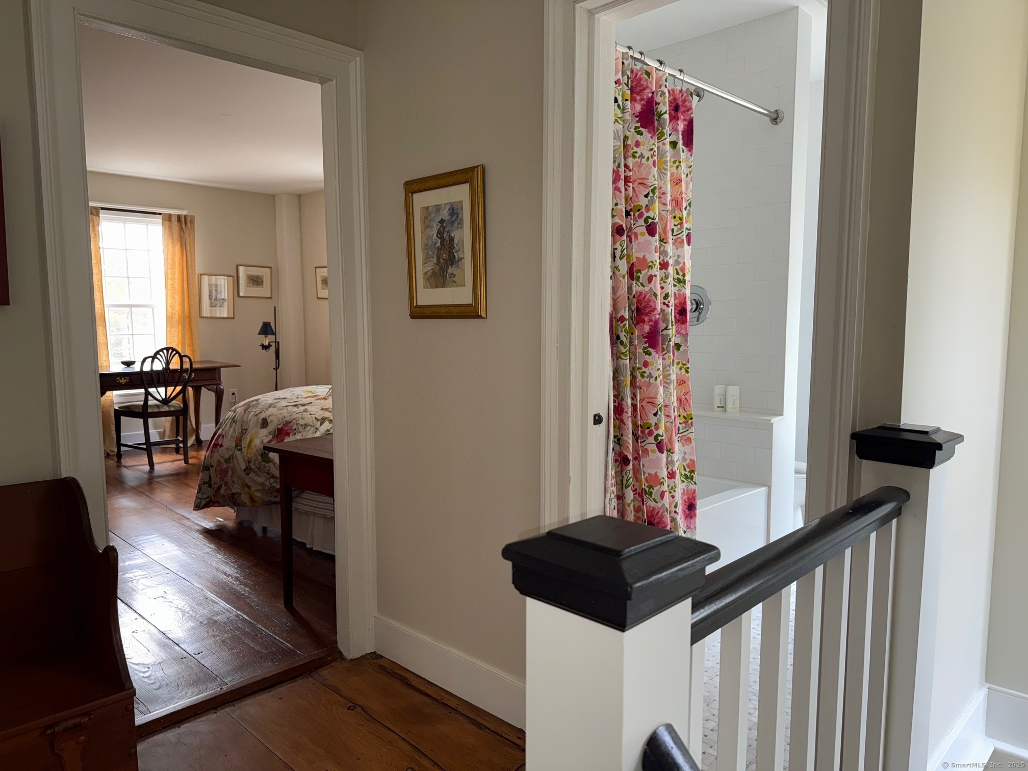 150 Ferry Road, Unit GATEHOUSE Lyme, CT 06371 - Photo 19 of 28 a bedroom with a bed and wooden floor