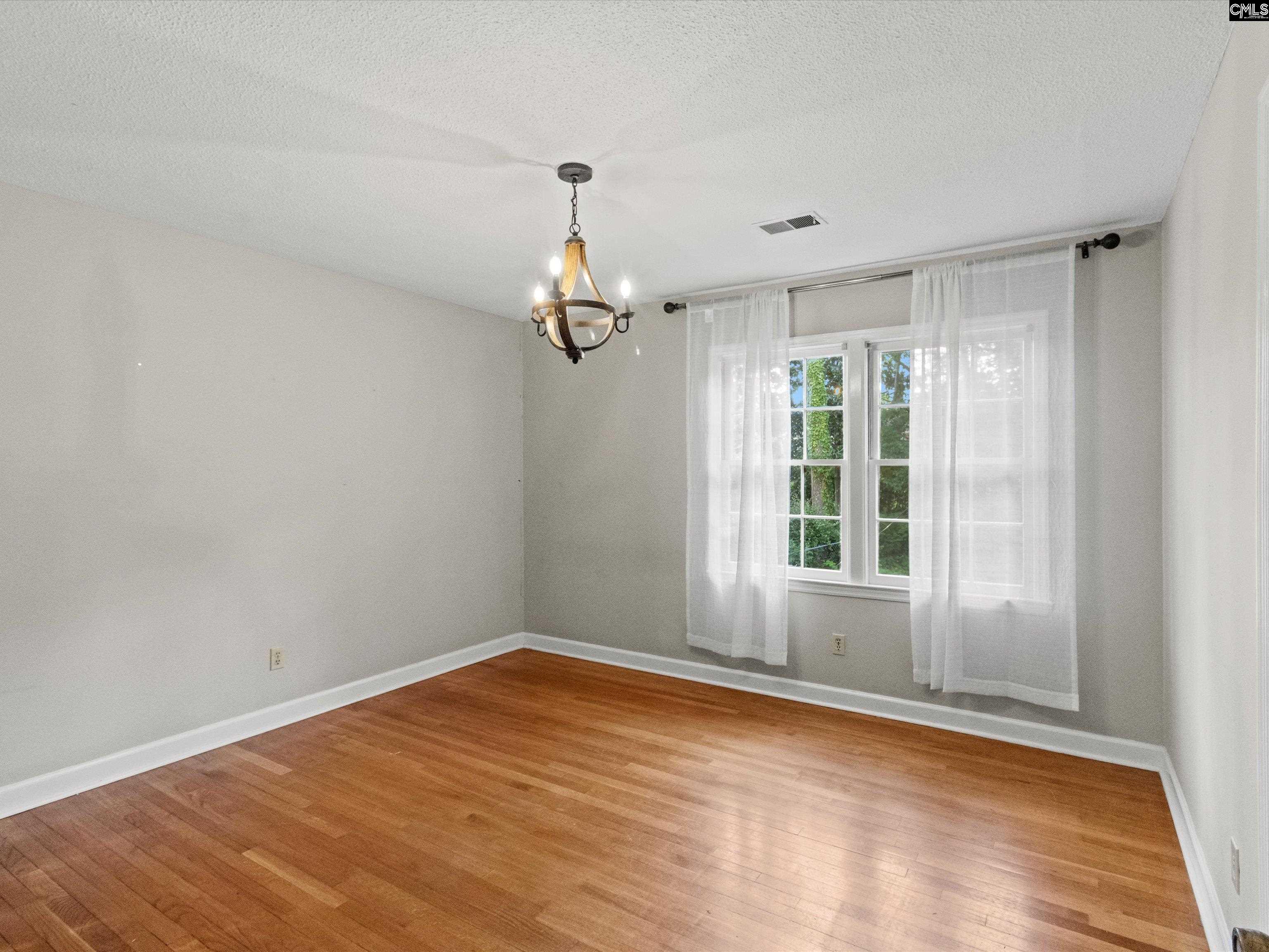 333 Lewisham Road Columbia, SC 29210 - Photo 28 of 35 a view of empty room with wooden floor and fan