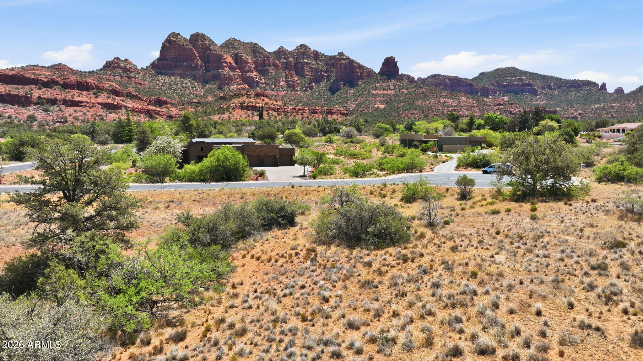 145 Little Park Road, Unit 10 Sedona, AZ 86351 - Photo 8 of 19 a view of a lush green hillside and a building