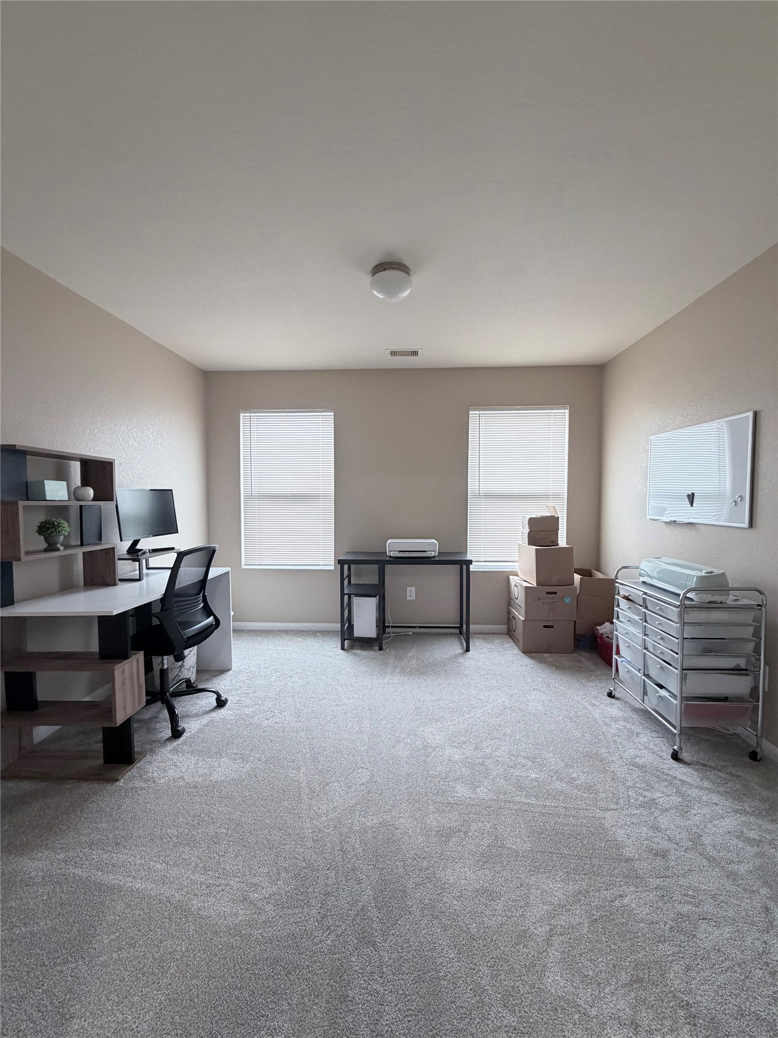 3226 Dappled Vale Trail Spring, TX 77373 - Photo 15 of 26 This room is a well-lit office space with neutral walls, carpet flooring, and two large windows.