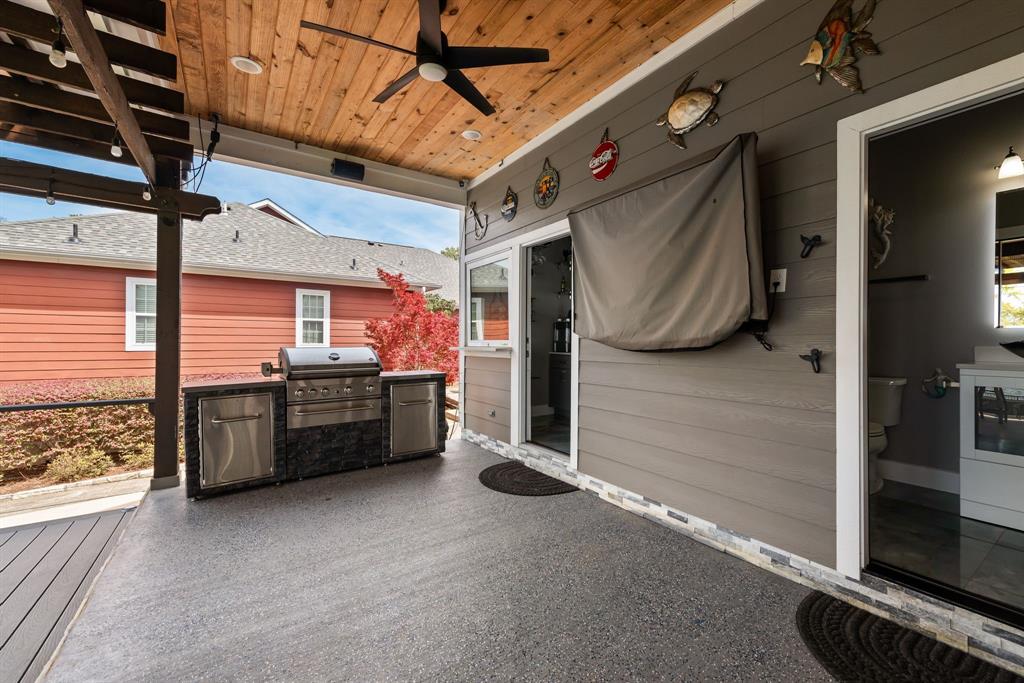 13032 Rudy's Way Streetman, TX 75859 - Photo 29 of 40 Covered patio with outdoor wet bar, TV, and built-in lakefront entertaining features.