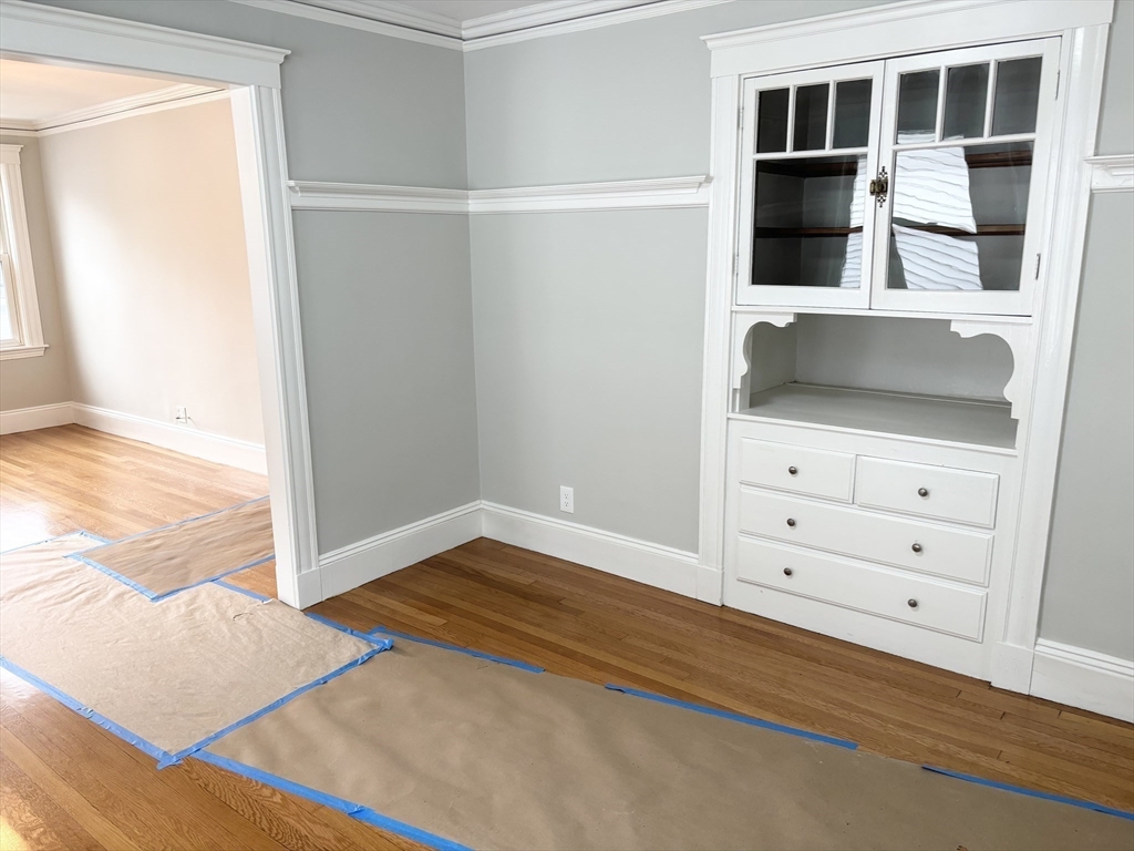 73 Dent Street, Unit 2 Boston, MA 02132 - Photo 18 of 41 a view of room with window and wooden floor