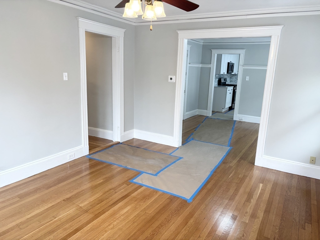 73 Dent Street, Unit 2 Boston, MA 02132 - Photo 19 of 41 wooden floor in a hall with an entryway