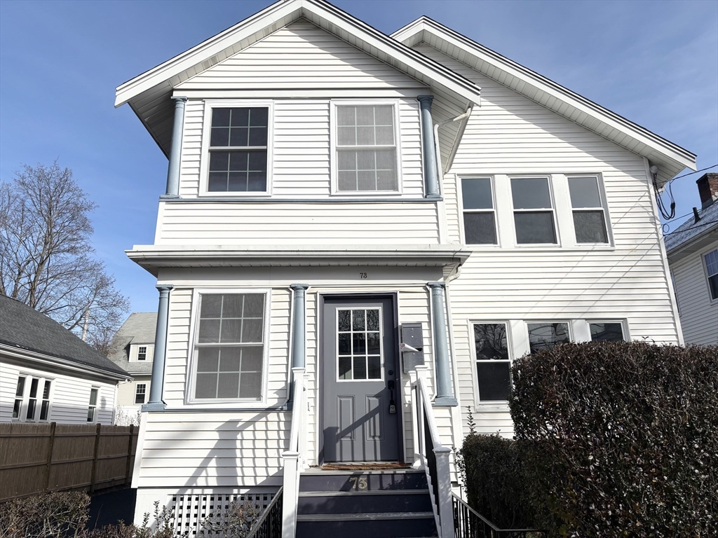 73 Dent Street, Unit 2 Boston, MA 02132 - Photo 2 of 41 a front view of a house with a yard