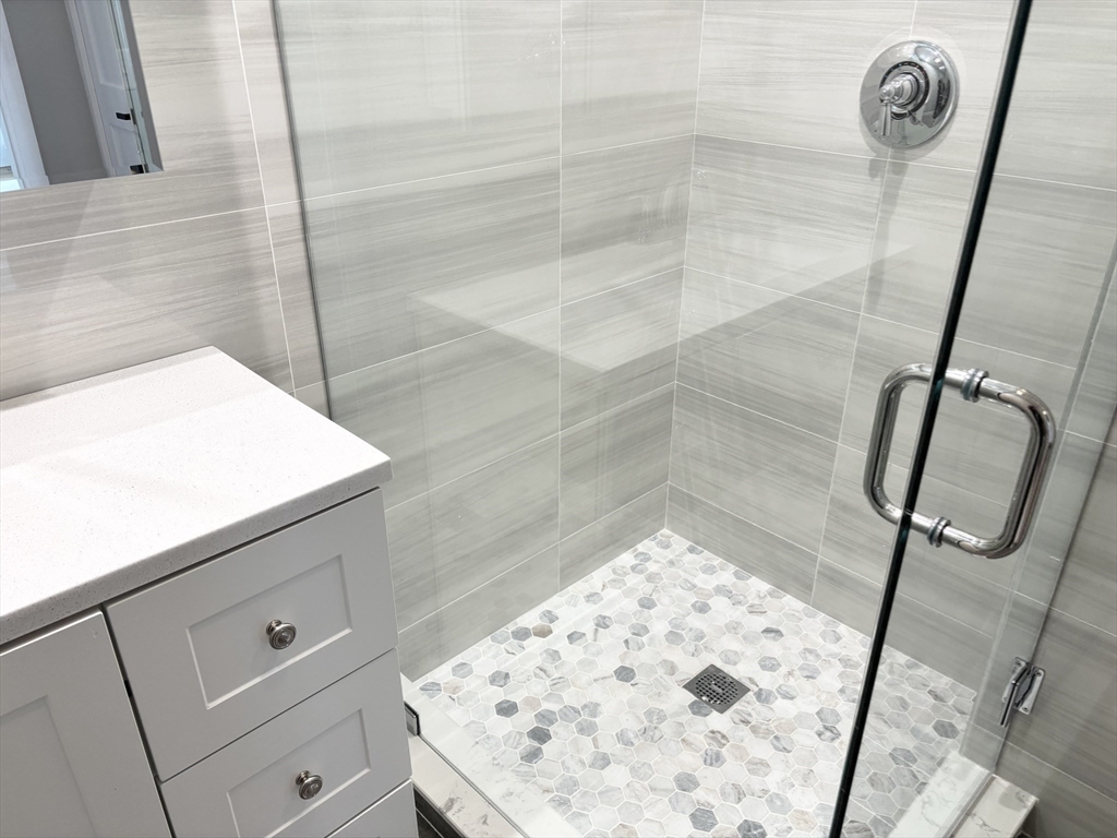 73 Dent Street, Unit 2 Boston, MA 02132 - Photo 25 of 41 a bathroom with a sink and a shower