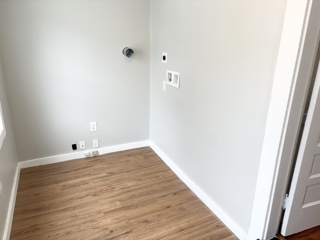 73 Dent Street, Unit 2 Boston, MA 02132 - Photo 34 of 41 a view of a small space with wooden floor