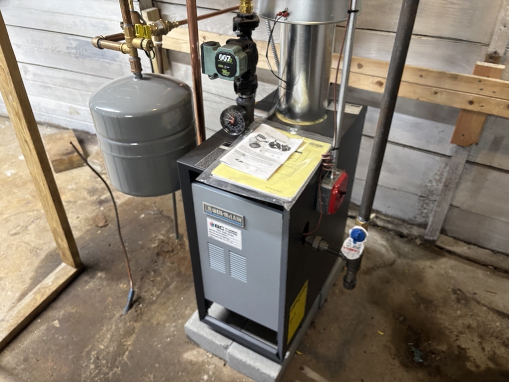 73 Dent Street, Unit 2 Boston, MA 02132 - Photo 35 of 41 a living room with chairs and a table