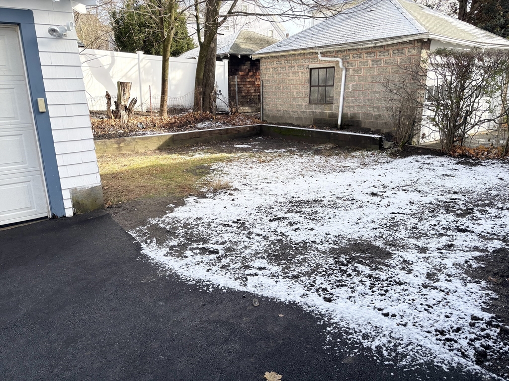 73 Dent Street, Unit 2 Boston, MA 02132 - Photo 39 of 41 a view of a house with a yard
