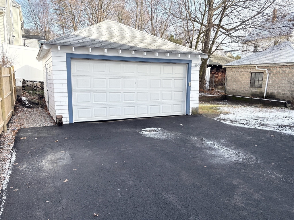 73 Dent Street, Unit 2 Boston, MA 02132 - Photo 5 of 41 a view of a house with a garage