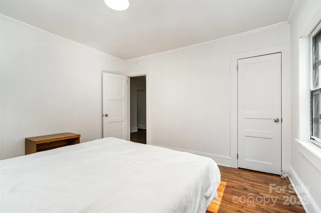 a room with a bed and a window