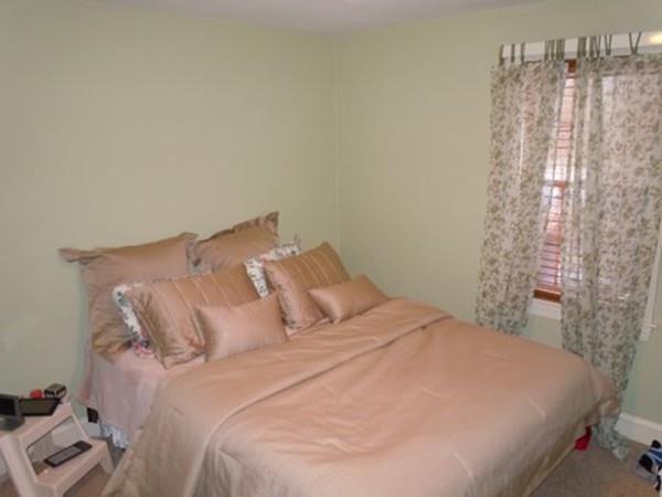 201 Turnpike Street North Andover, MA 01845 - Photo 13 of 20 a large bed sitting in a bedroom next to a window