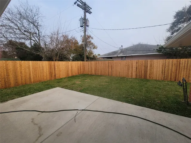 a backyard of a house with lots of green space
