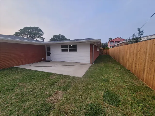 a view of a backyard with a garden and plants