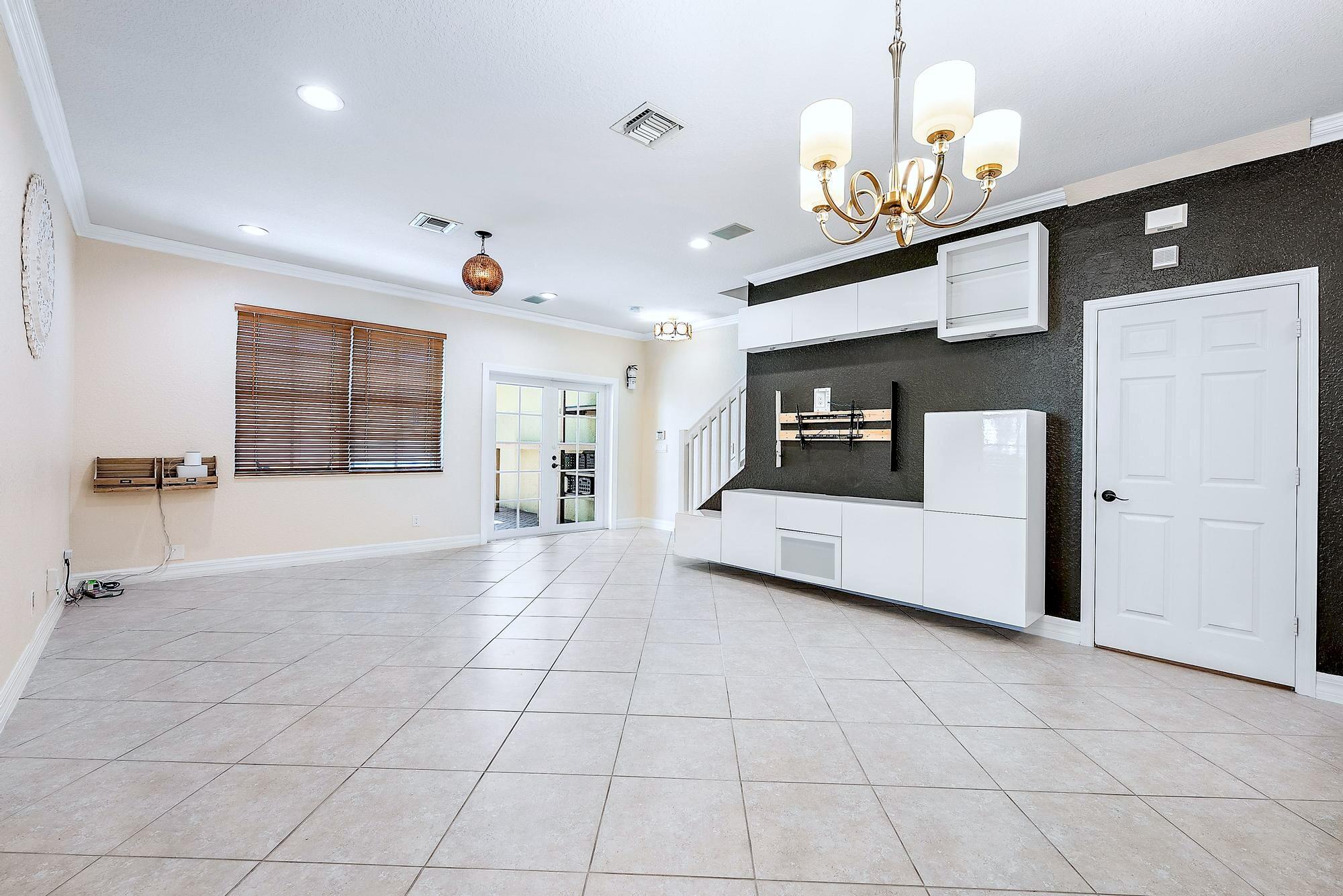 203 East Bay Cedar Circle Jupiter, FL 33458 - Photo 22 of 64 a view of an empty room with a window