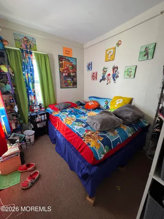 a kids bedroom with toys and dresser