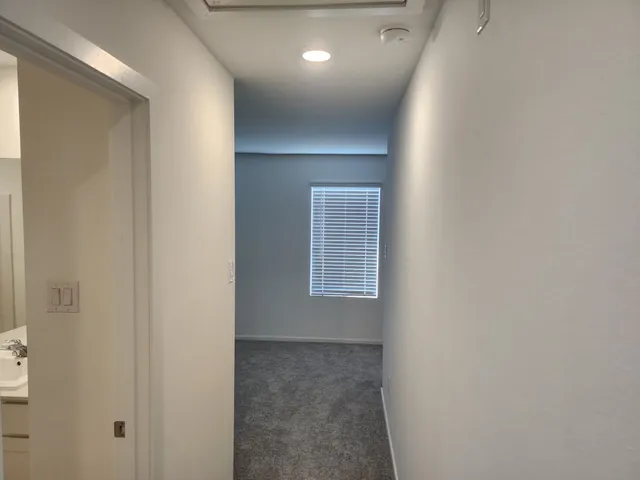 a view of livingroom and hallway with windows