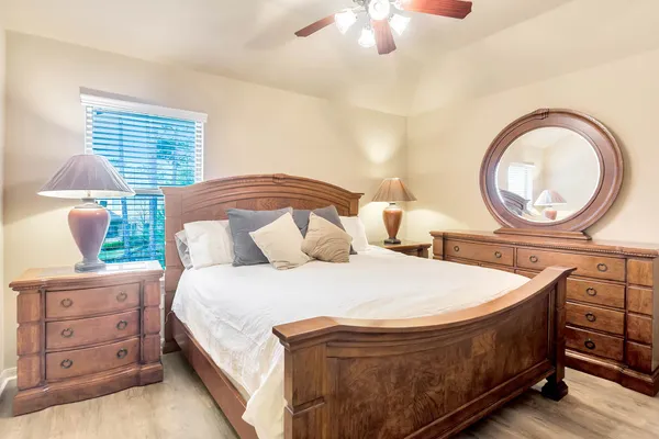 a bedroom with a bed and a dresser