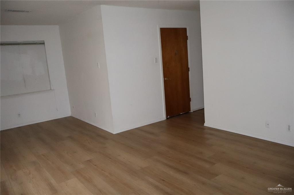 27 Las Palmas Road Zapata, TX 78076 - Photo 11 of 14 a view of an empty room with wooden floor