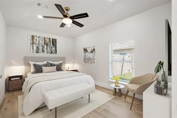 a bedroom with a bed a furniture and a window