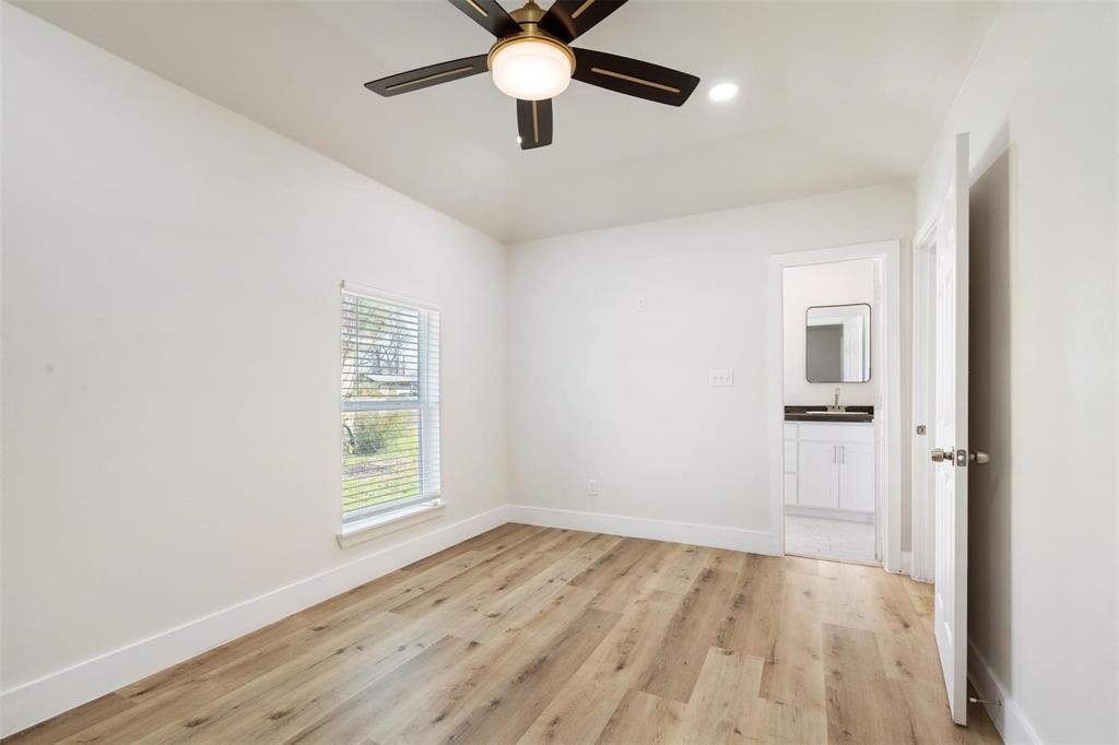 4024 Carolyn Road Fort Worth, TX 76109 - Photo 9 of 11 wooden floor in an empty room with a window