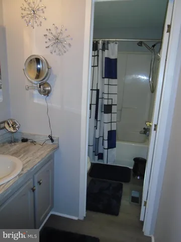 a bathroom with a sink and mirror