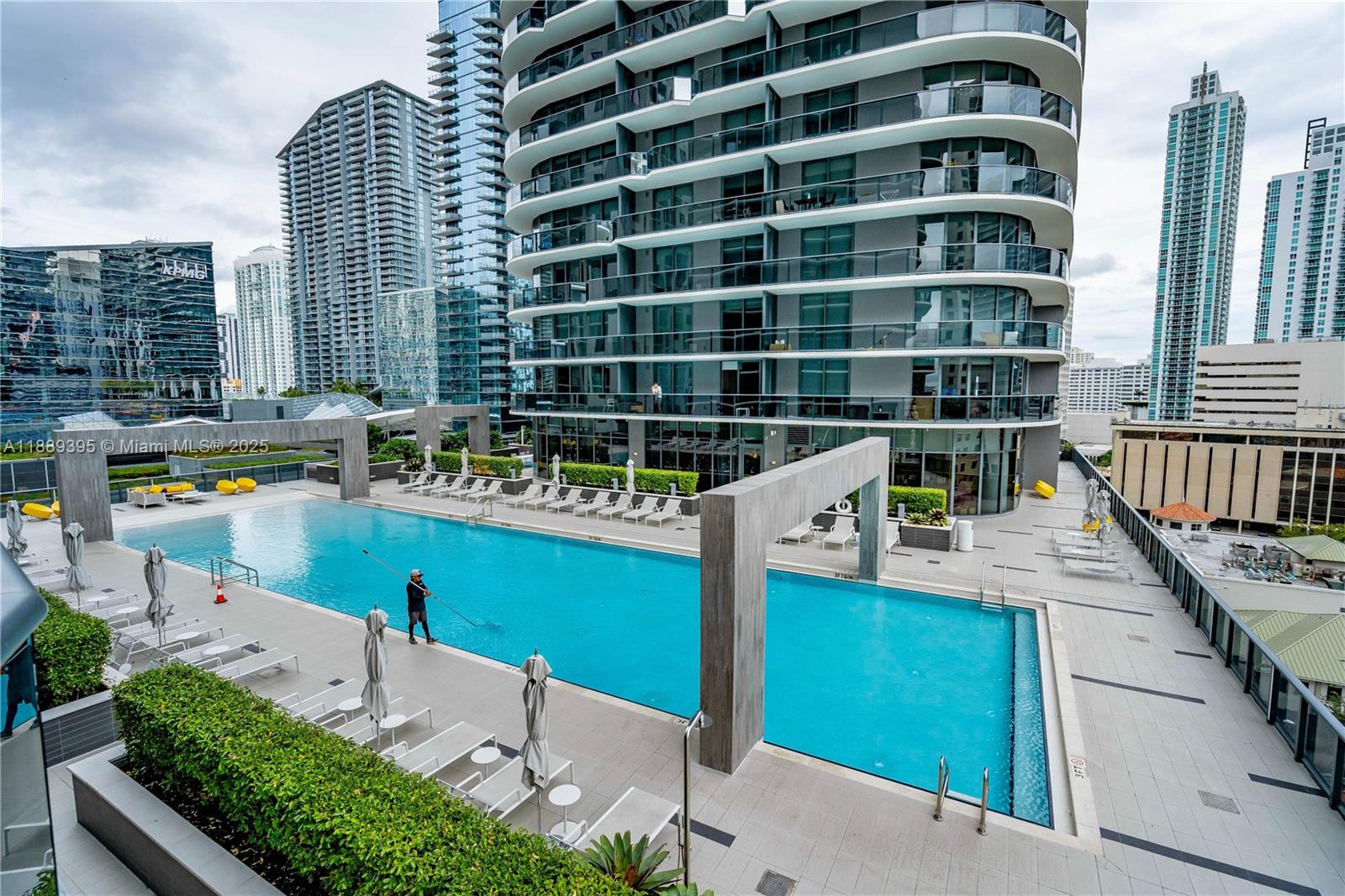 55 Southwest 9th Street, Unit 2201 Miami, FL 33130 - Photo 47 of 58 Sparkling clean pool and view over the iconic roof of the Brickell City Center