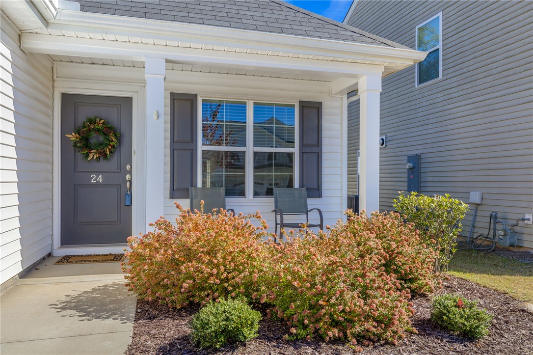 24 Chalet Court Anderson, SC 29621 - Photo 5 of 39 This charming front exterior offers a welcoming entry with an inviting porch and lush landscaping.