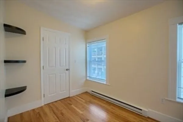 a bathroom with a granite countertop toilet sink and mirror
