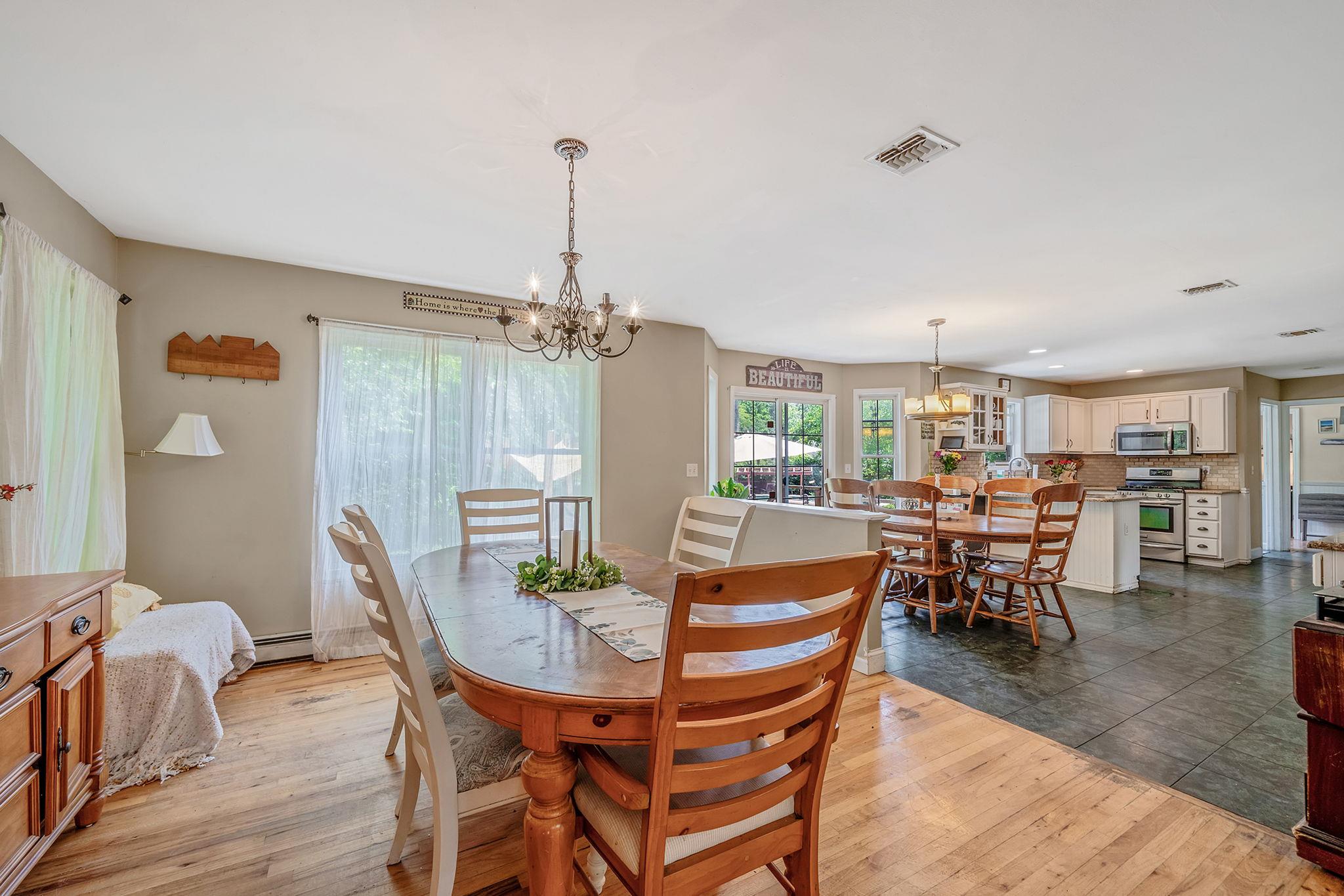 4 Ariel Court Rocky Point, NY 11778 - Photo 11 of 45 a dining room with furniture and wooden floor