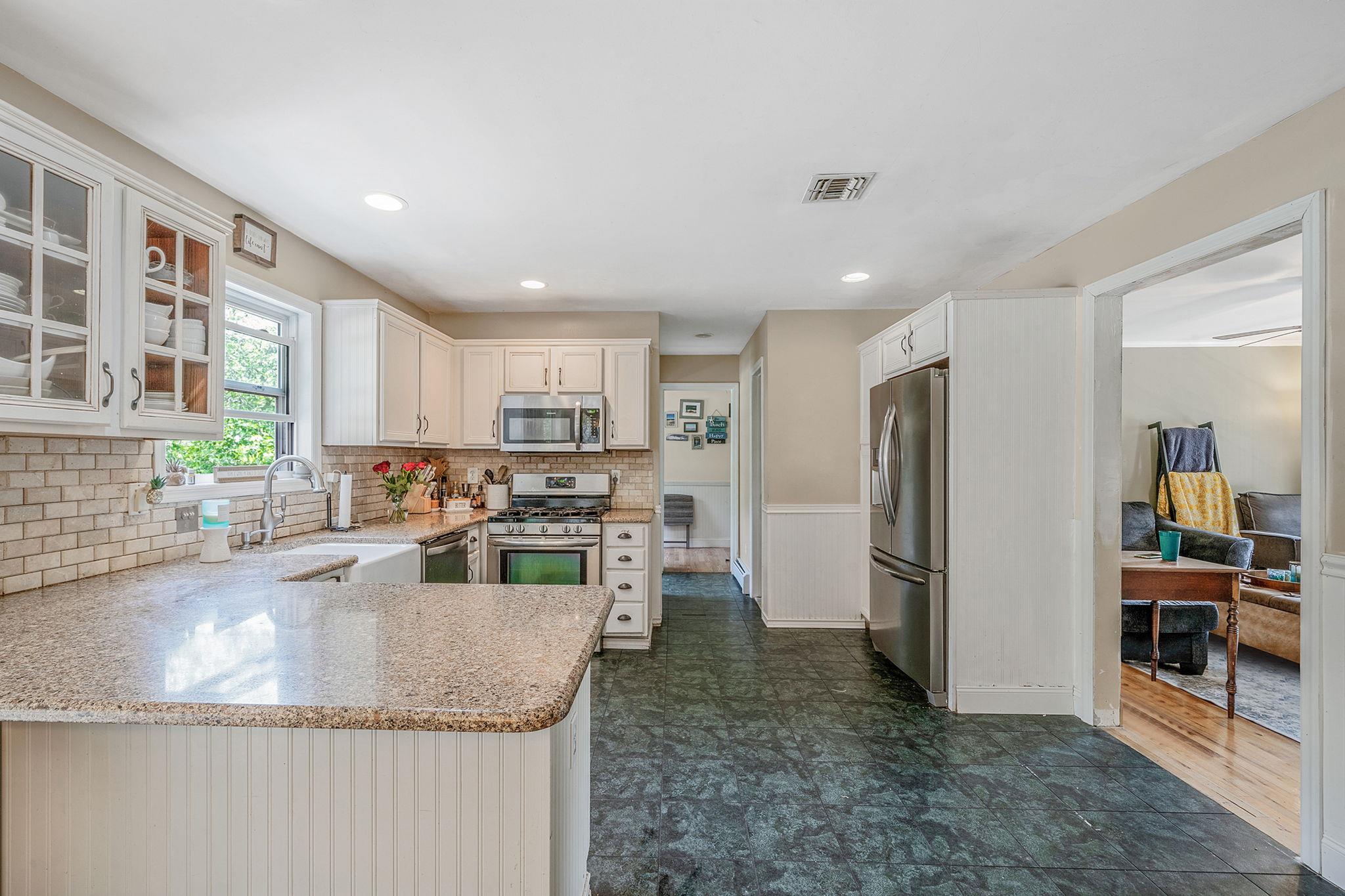4 Ariel Court Rocky Point, NY 11778 - Photo 13 of 45 a kitchen with stainless steel appliances granite countertop a refrigerator and a sink