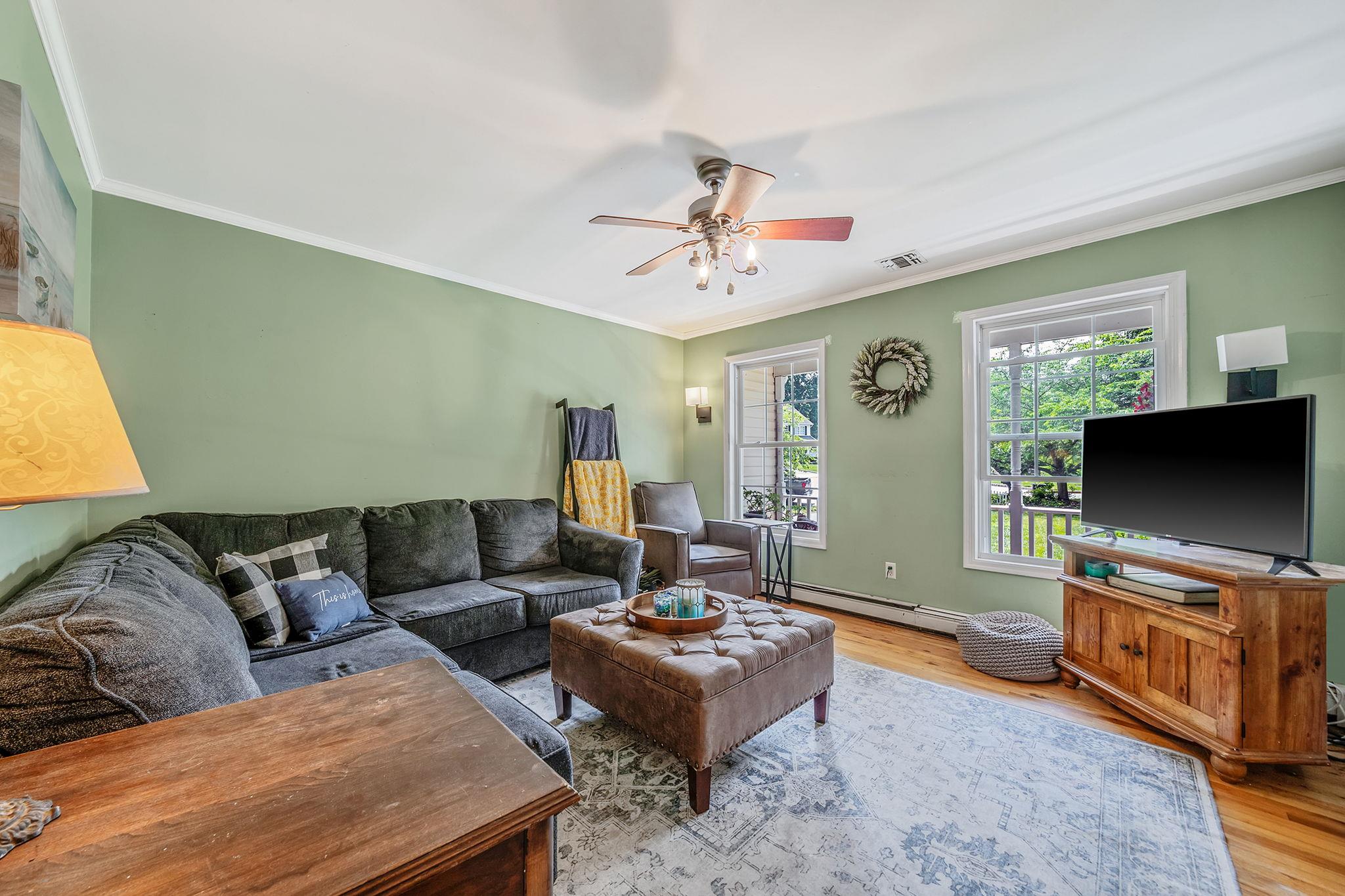 4 Ariel Court Rocky Point, NY 11778 - Photo 17 of 45 a living room with furniture and a flat screen tv