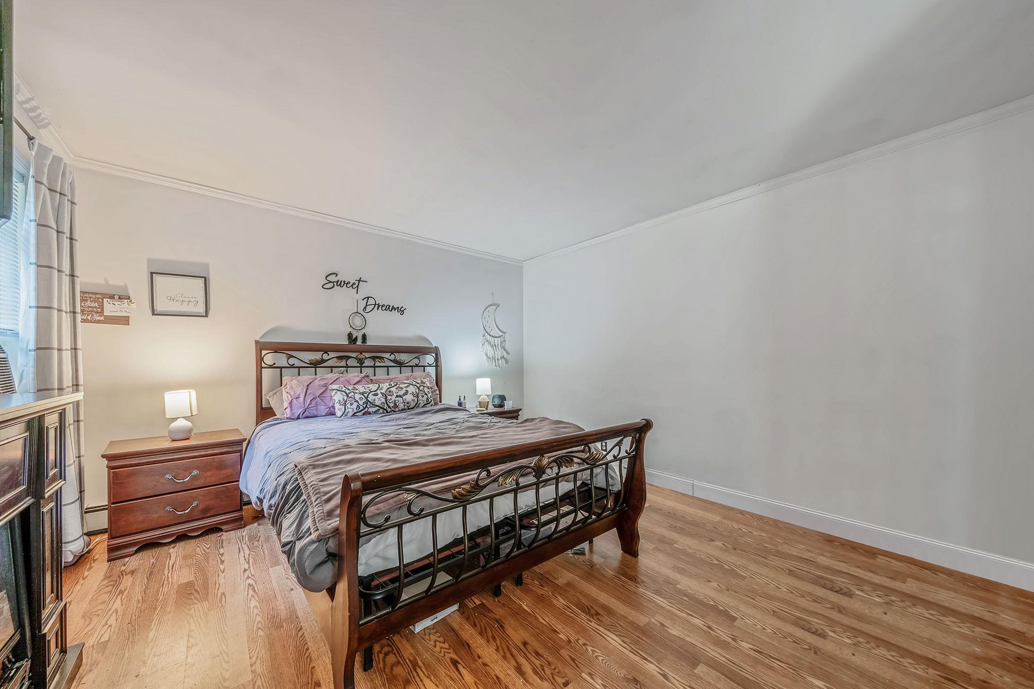 4 Ariel Court Rocky Point, NY 11778 - Photo 21 of 45 a bedroom with a bed and a table