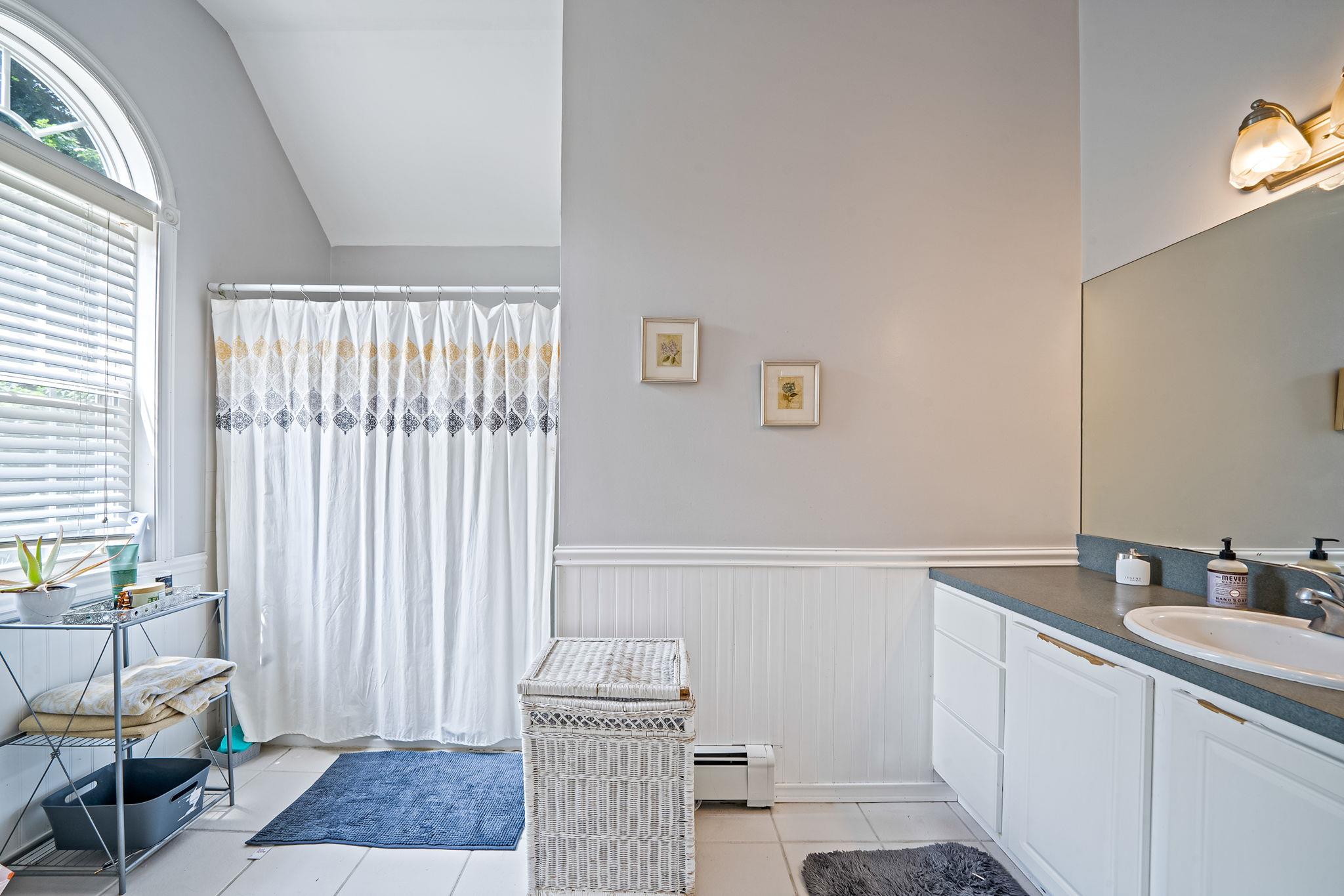 4 Ariel Court Rocky Point, NY 11778 - Photo 25 of 45 a bathroom with a sink a toilet and tub