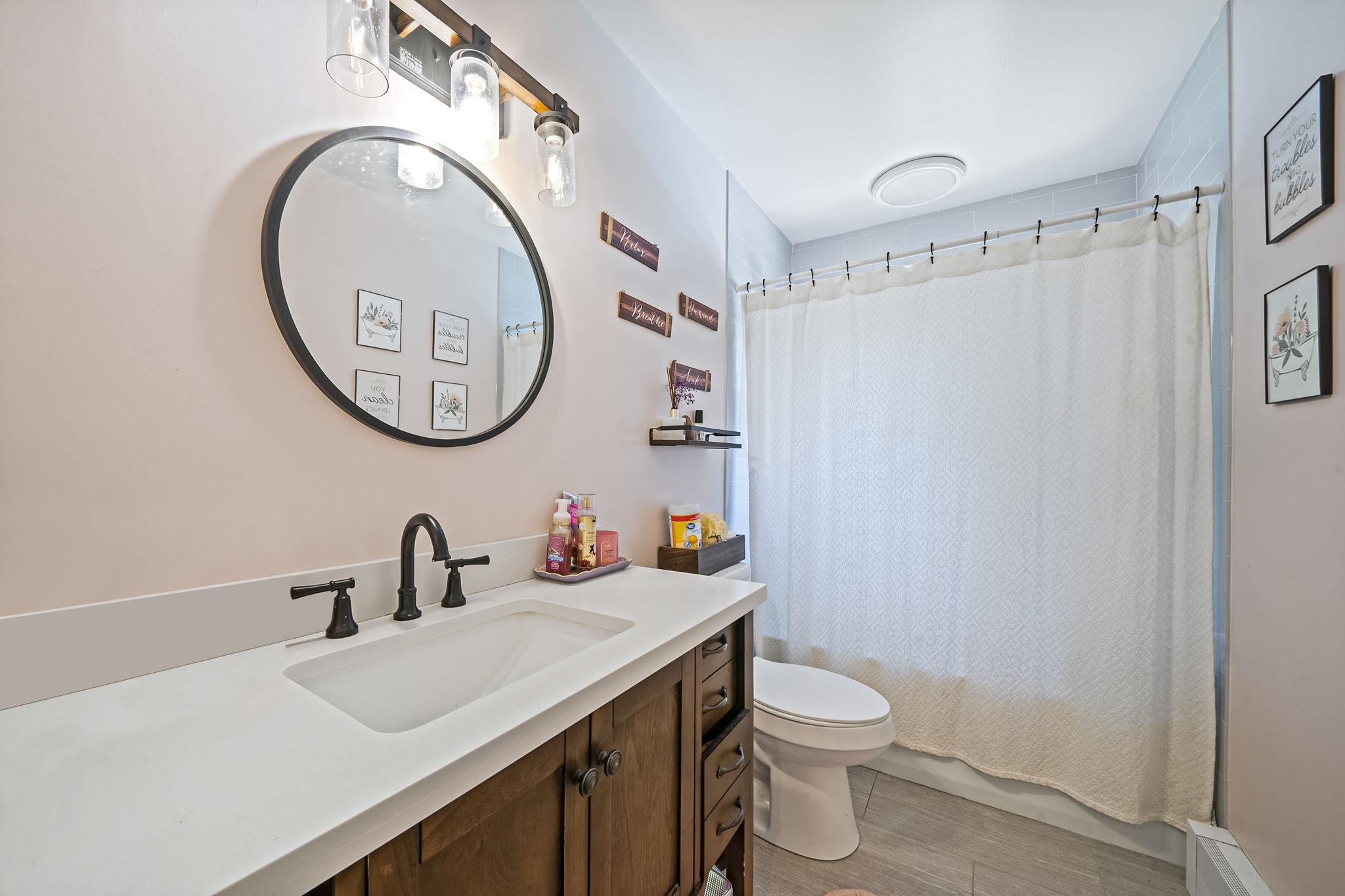 4 Ariel Court Rocky Point, NY 11778 - Photo 28 of 45 a bathroom with a toilet a sink and a mirror