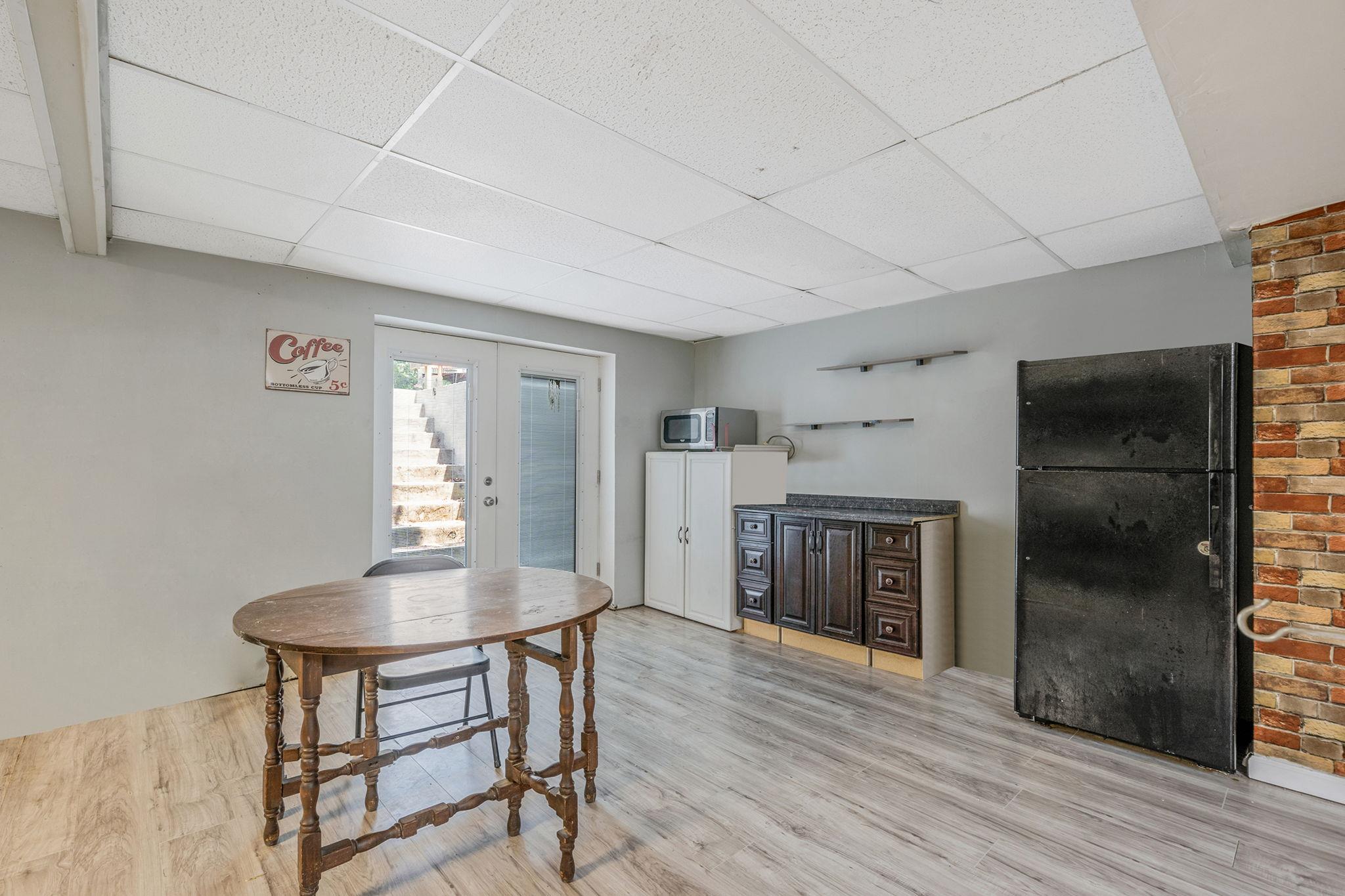 4 Ariel Court Rocky Point, NY 11778 - Photo 31 of 45 a workspace with wooden floor a fireplace and windows