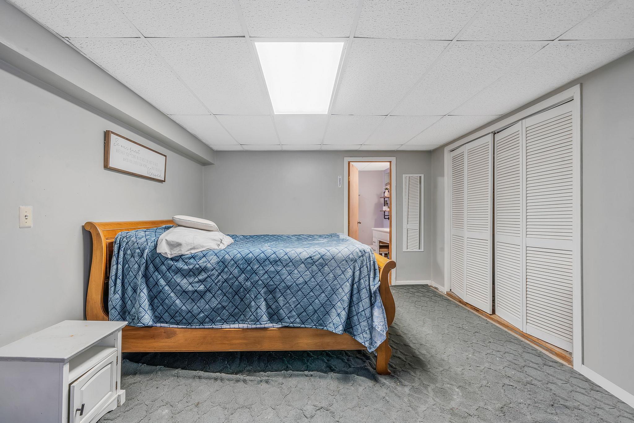 4 Ariel Court Rocky Point, NY 11778 - Photo 32 of 45 a bedroom with a bed and a cabinets