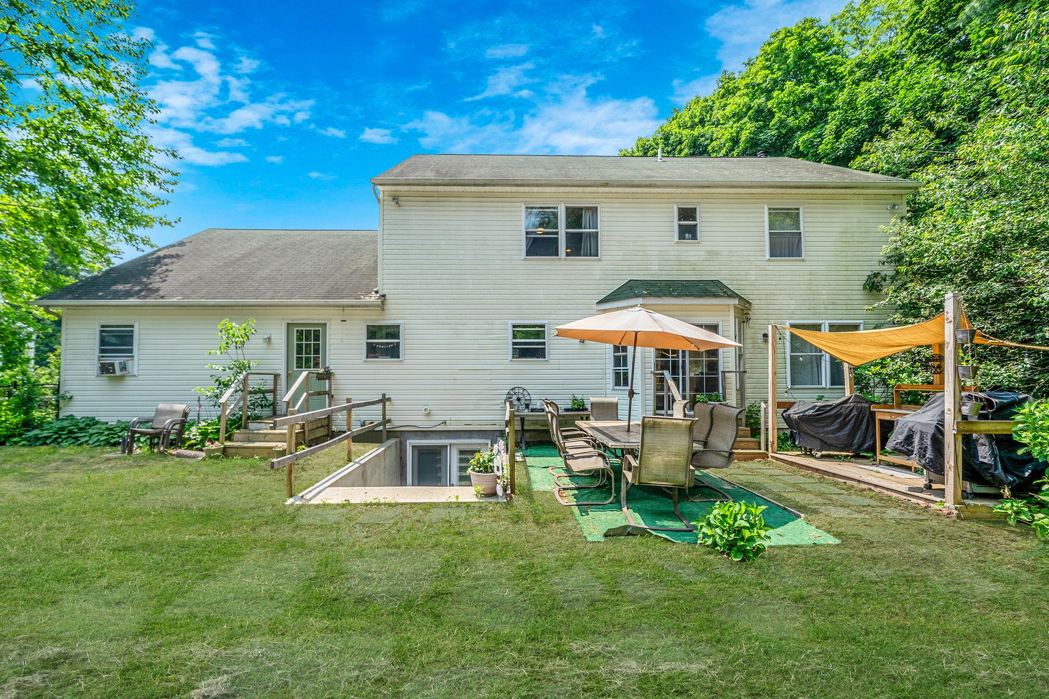 4 Ariel Court Rocky Point, NY 11778 - Photo 42 of 45 a front view of house with a garden and patio