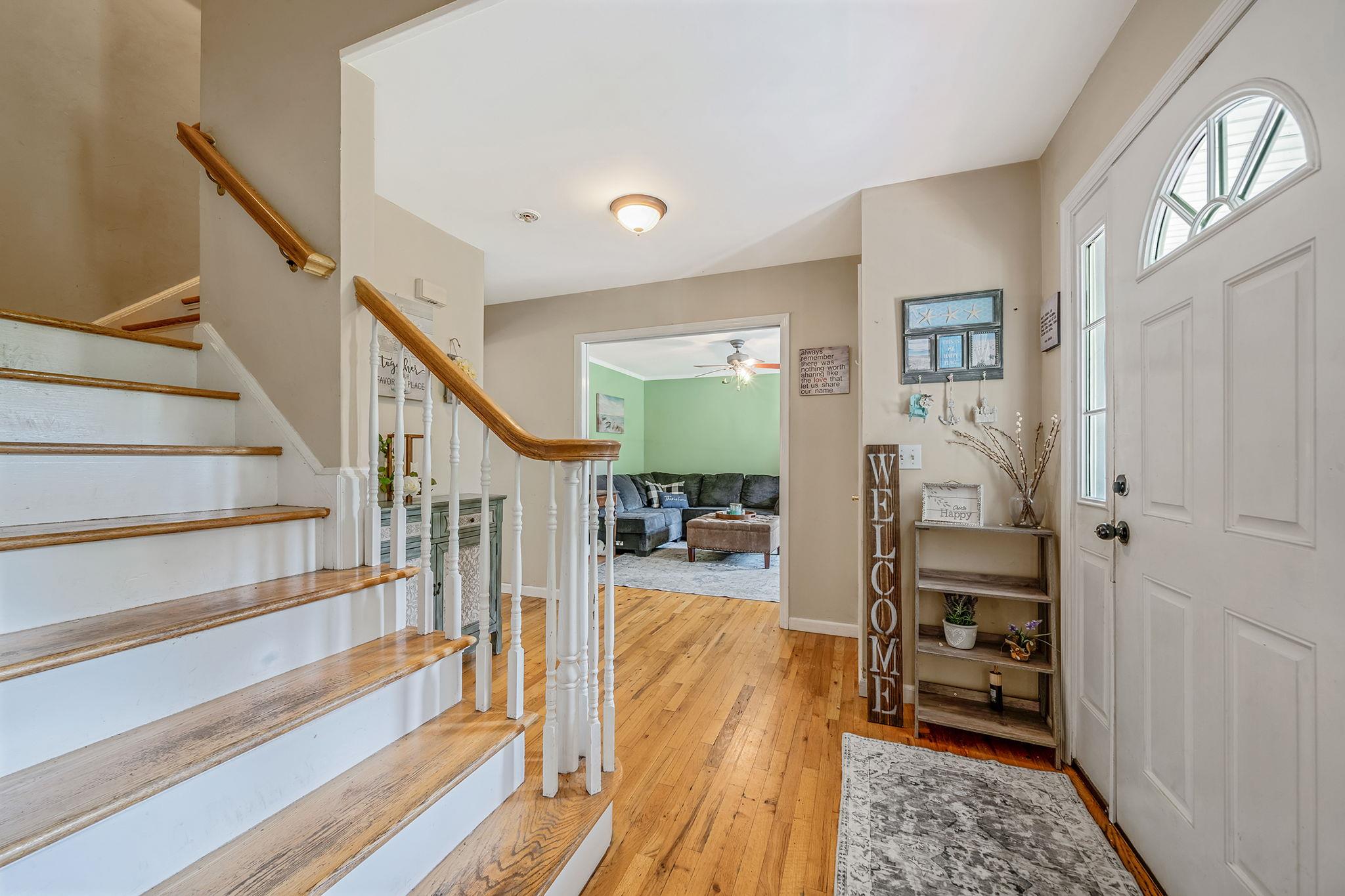 4 Ariel Court Rocky Point, NY 11778 - Photo 7 of 45 a view of entryway and hall with wooden floor