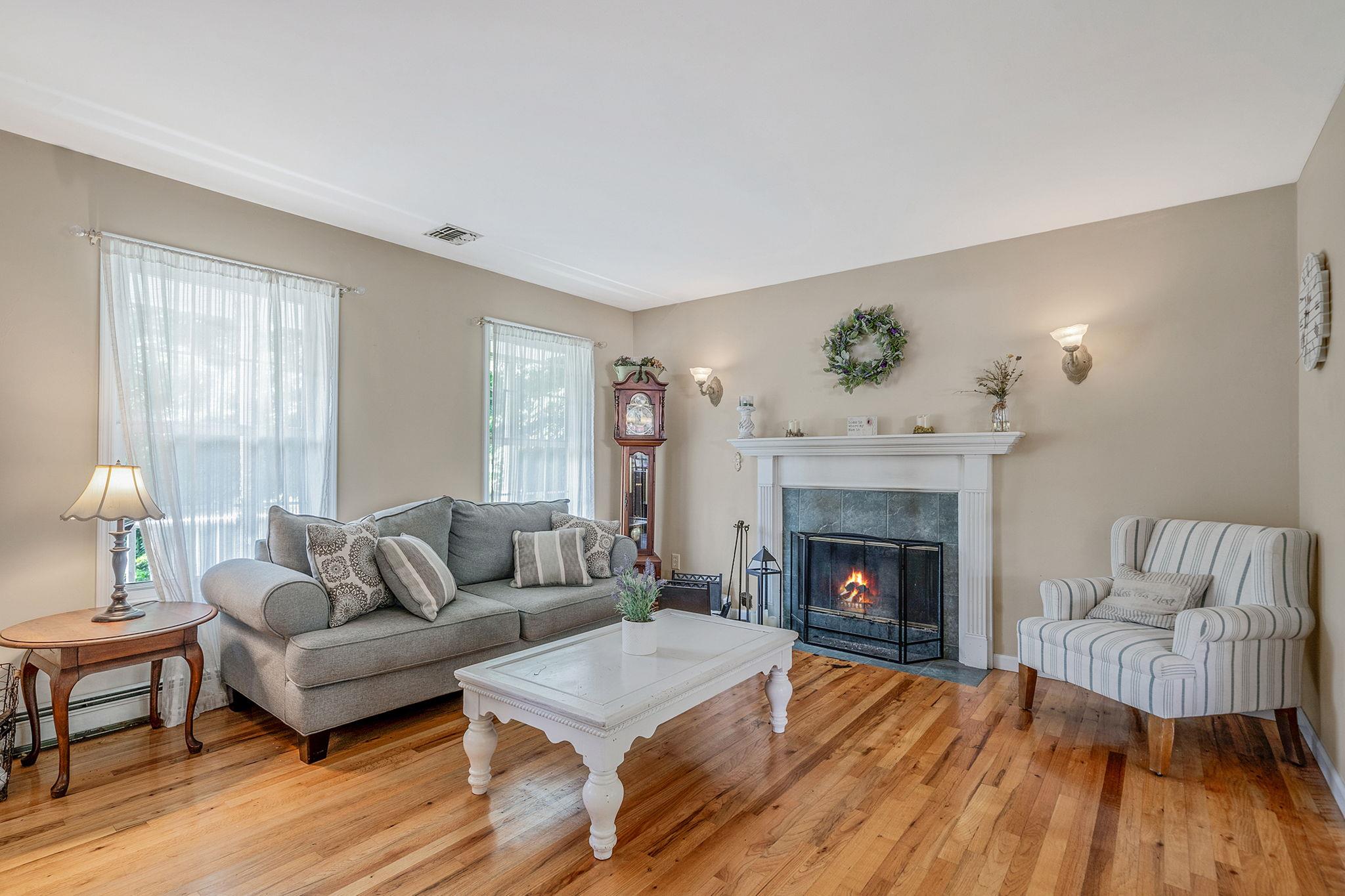 4 Ariel Court Rocky Point, NY 11778 - Photo 9 of 45 a living room with furniture and a fireplace