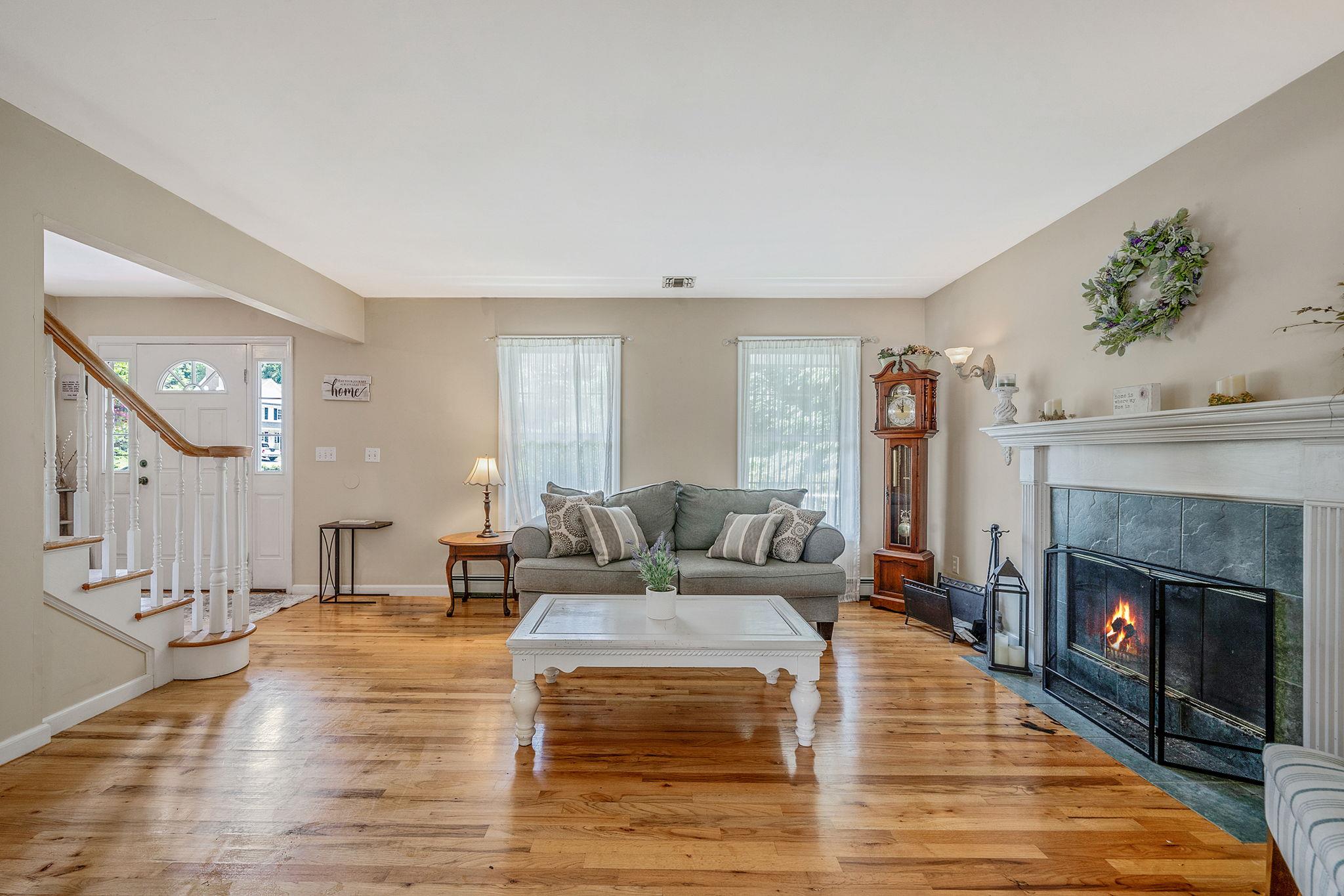 4 Ariel Court Rocky Point, NY 11778 - Photo 10 of 45 a living room with furniture and a fireplace