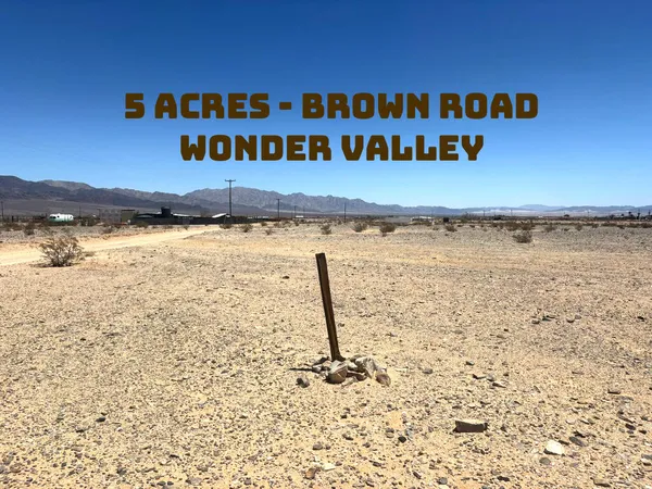 a view of a street with an ocean view