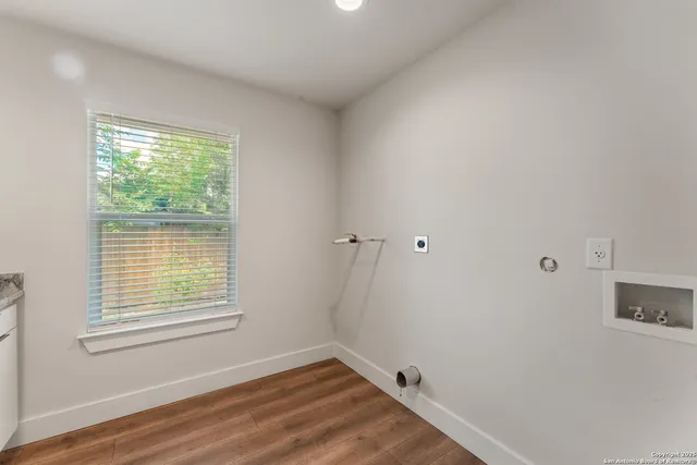a kitchen with a sink and a refrigerator