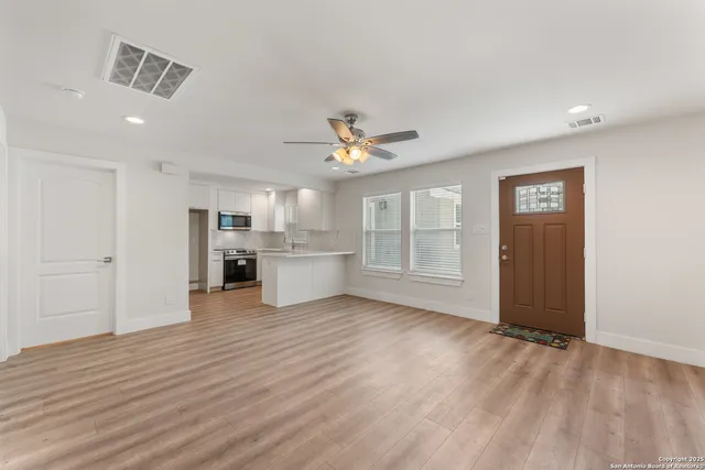 a view of kitchen with wooden floor and window