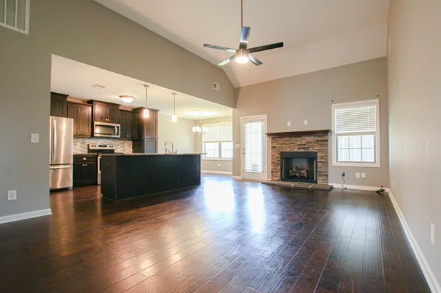 a view of kitchen with furniture and wooden floor