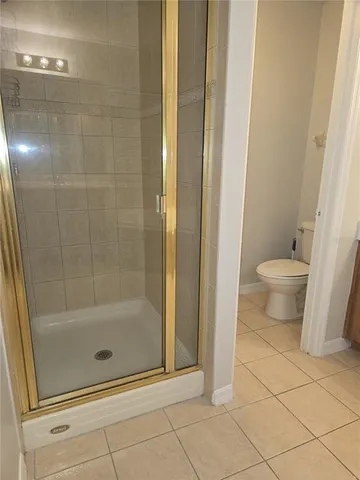 a bathroom with a shower and a toilet