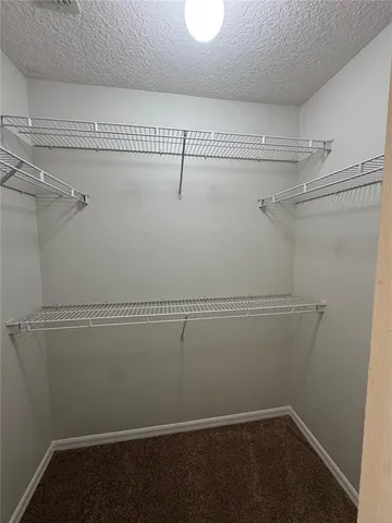 a view of a room with racks on the wall